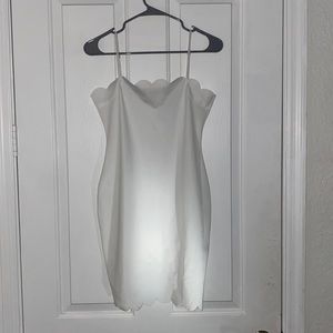 Scalloped edge white mini dress